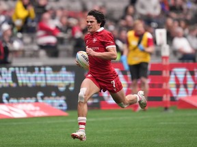 Canada's Brock Webster runs for his second try against Scotland during HSBC Canada Sevens rugby action, in Vancouver, on Sunday, April 17, 2022. Canada's men fell victim to a furious Argentina comeback on Friday, conceding three late tries to lose 24-19 at the HSBC Sydney Sevens.