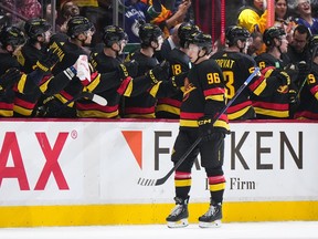 Vancouver Canucks' Andrei Kuzmenko celebrates his first goal against the Chicago Blackhawks during the second period of an NHL hockey game in Vancouver, on Tuesday, January 24, 2023. In a season marked by loss and frustration, the Russian forward with the dimpled grin, gravity defying hair and enthusiastic goal celebrations has been a rare bright spot both on and off the ice.