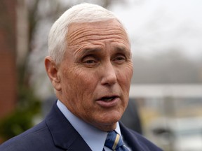 FILE - Former Vice President Mike Pence speaks with reporters Dec. 6, 2022, at Garden Sanctuary Church of God in Rock Hill, S.C. The executive director of former U.N. Ambassador Nikki Haley's political action committee is leaving to help run PAC efforts for Pence.