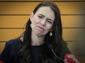 New Zealand Prime Minister Jacinda Ardern grimaces as she announces her resignation at a press conference in Napier, New Zealand Thursday, Jan. 19, 2023. Ardern says that she will not contest this year's general elections.