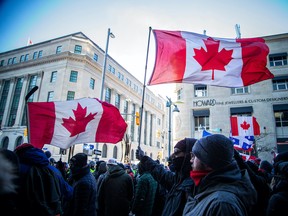 OTTAWA -- Police from all different forces across the country joined together to try to bring the “Freedom Convoy” occupation to an end Saturday, February 19, 2022. Early Saturday evening protesters had what felt like a last hurrah party at the corner of Sparks Street and Bank Street as police held a line across Bank.