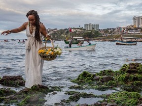 This is easily one of the most ethereal photos we’ve seen in some time. The shot is from Salvator, Brazil, and it’s of worshippers taking part in the ceremony of Iemania, the Goddess of the Sea in the Afro-Brazilian religion Umbanda.