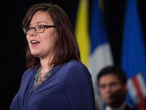 Alberta Minister of Justice and Solicitor General Kathleen Ganley speaks during a news conference in Vancouver on Friday, Sept. 15, 2017. Ganley says it's a "huge concern" that Smith, before she re-entered politics, lobbied for an oilwell cleanup bailout that she made a government priority when she became premier.