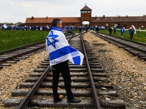 Participants are seen taking part in the March of the Living at the former Auschwitz Birkenau concentration and extermination camp in Brzezinka, Poland, in 2022.