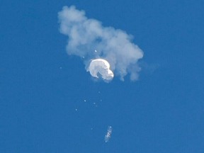 FILE PHOTO: The suspected Chinese spy balloon drifts to the ocean after being shot down off the coast in Surfside Beach, South Carolina, U.S. February 4, 2023.