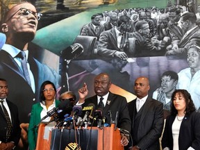 Civil rights attorney Ben Crump (C), joined by co-counsel Ray Hamlin and the daughters of Malcolm X, Ilyasah Shabazzv and Malaak Shabazz, speaks during a press conference at the Malcolm X & Dr. Betty Shabazz Memorial and Educational Center in New York City on February 21, 2023.