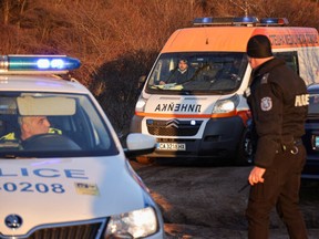 An ambulance leaves the site after at least 18 people were found dead in Bulgaria in an abandoned truck near the capital Sofia, according to the Bulgarian Interior Ministry, in Bulgaria, February 17, 2023.
