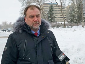 Street preacher and political activist Artur Pawlowski speaks to reporters outside the Alberta legislature in Edmonton, January 12, 2023.