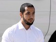 Awso Peshdary, who is accused of recruiting for ISIL, is escorted by police as he arrives for a hearing at the Supreme Court of Canada in Ottawa on August 13, 2018.