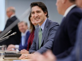 Canada's Prime Minister Justin Trudeau, with federal ministers and officials, takes part in a meeting with Provincial and Territorial premiers to discuss healthcare, in Ottawa, Ontario, Canada, February 7, 2023. REUTERS/Blair Gable