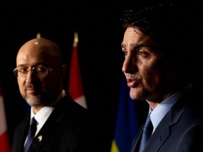 Ukraine's Prime Minister Denys Shmyhal looks at Canada's Prime Minister Justin Trudeau during a joint news conference in Toronto. “Canada will continue to be steadfast in our support of Ukraine as you defend yourselves heroically against Putin’s brutal, barbaric invasion,” Trudeau said.