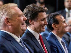 Ontario Premier Doug Ford, Prime Minister Justin Trudeau and AstraZeneca CEO Pascal Soriot at an announcement in Mississauga, Ontario, on February 27, 2023.