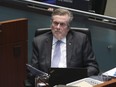 Toronto Mayor John Tory listens as city council starts to debate its budget at city hall, February 15, 2023.