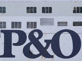 FILE PHOTO: Passengers look out of the windows of a P&O ferry in the port of Dover, U.K.