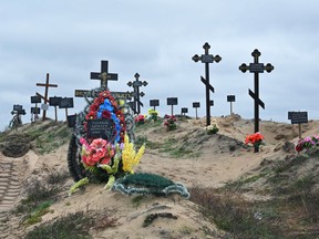 A mass grave of civilians at a cemetery near Lyman, Ukraine, on October 11, 2022.