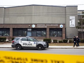 Toronto police investigate the shooting of a student outside Weston Collegiate Institute on February 16, 2023.