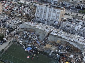 Aerial photo shows the destruction in Hatay city centre, southern Turkey, Tuesday, Feb. 7, 2023. Donations are pouring into a Vancouver warehouse for those affected by Monday's devastating earthquake in Turkey but a volunteer organizer says the country could most benefit from professional search and rescues teams.THE CANADIAN PRESS/AP, IHA