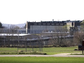 FILE - The Souza-Baranowski Correctional Center is surrounded by fencing, Wednesday, April 19, 2017, in Lancaster, Mass. A proposal to let Massachusetts prisoners donate organs and bone marrow to shave time off their sentence is raising profound ethical and legal questions about putting undue pressure on inmates desperate for freedom.