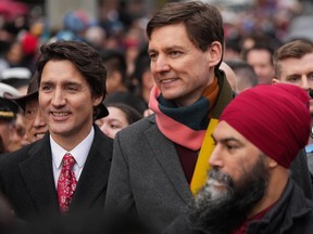 Prime Minister Justin Trudeau, B.C. Premier David Eby and NDP leader Jagmeet Singh prepare to march in the Lunar New Year parade in Chinatown, in Vancouver, Jan. 22, 2023.