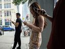 People use electronics outside a coffee shop in Toronto. The CRTC has in recent years been under criticism from consumer advocates for its handling of the wholesale internet regime.
