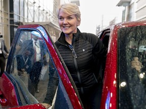 Energy Secretary Jennifer Granholm gets into the passenger seat after test driving a Ford F-150 Lighting all electric vehicle during a visit to the Washington Auto Show in Washington, Wednesday, Jan. 25, 2023.