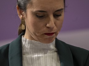 FILE - Spain's Equality Minister Irene Montero looks down during a press conference after an emergency meeting for a worrying surge of gender violence in Madrid, Spain, on Jan. 27, 2023. Spain's parliament passed laws on Thursday Feb. 16, 2023 expanding abortion and transgender rights for teenagers, while making Spain the first country in Europe entitling workers to paid menstrual leave.