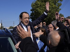 FILE - Presidential candidate Nikos Christodoulides greets his supporters after casting his vote during the presidential elections in Geroskipou in south west coastal city of Paphos, Cyprus, Sunday, Feb. 12, 2023. The new president of Cyprus is meeting informally with the leader of the breakaway Turkish Cypriots Thursday, Feb. 23, to test the waters on reviving stalemated talks to end the island's ethnic division. It has been a source of instability in the east Mediterranean for decades.