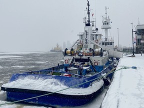Two tugboats that have been detained by Transport Canada are shown in Trois-Rivières, Que. on Thursday, Feb. 2, 2023. Groups that advocate for seafarers are expressing concern for crew members who are spending a harsh Quebec winter aboard three tugboats that have been stuck in the port of Trois-Rivières for months.