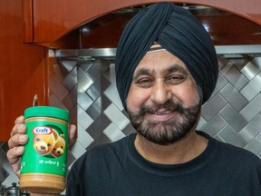 Nav Bhatia holding a Welcome Home Jar.