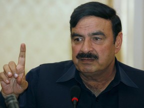 FILE - Pakistan's Muslim League-Q party leader Sheikh Rashid Ahmed gestures during a press conference in Islamabad, Pakistan, on Feb. 20, 2008. Pakistani police arrested the prominent political figure in an overnight raid on his home near Islamabad days after he accused the former president of the country of plotting to kill ex-prime minister Imran Khan, officials said Thursday, Feb. 2, 2023.