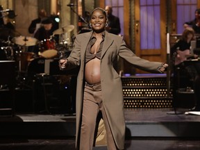 This image released by NBC shows host Keke Palmer revealing her pregnancy during her monologue on "Saturday Night Live" in New York on Dec. 3, 2022.
