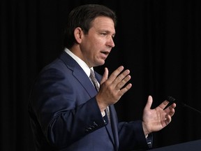 FILE - Florida Gov. Ron DeSantis speaks, Feb. 15, 2023, at Palm Beach Atlantic University in West Palm Beach, Fla. Gov. DeSantis has signed a bill to give himself control of Walt Disney World's self-governing district, punishing the company over its opposition to the so-called "Don't Say Gay" law. The bill requires DeSantis, a Republican, to appoint a five-member board to oversee the government services that the Disney district provides in its sprawling theme park properties in Florida. The governor signed the legislation on Monday, Feb. 27, 2023.