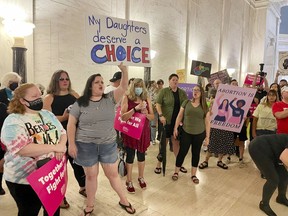 FILE - Abortion rights protesters chant outside the West Virginia Senate chambers prior to a vote on an abortion bill, July 29, 2022, in Charleston, W.Va. An abortion provider filed a lawsuit on Wednesday, Feb 1, 2023, seeking to overturn West Virginia's near-total ban, saying it is unconstitutional, irrational and causes irreparable harm to the state's only abortion clinic and its patients.
