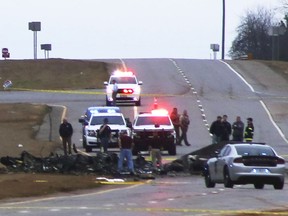 Law enforcement work at the scene of a Black Hawk helicopter crash Wednesday, Feb. 15, 2023, in the unincorporated community of Harvest, Ala. U.S. military officials say two people on board the helicopter, which was from the Tennessee National Guard, were killed.