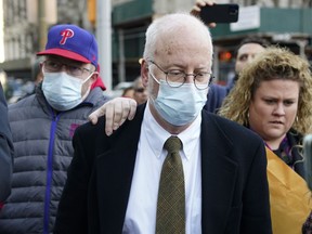 FILE - Robert Hadden, center, leaves the federal courthouse in New York, Tuesday, Jan. 24, 2023. A federal judge in New York City ruled Wednesday, Feb. 1, that Hadden, an ex-gynecologist convicted of sexually abusing hundreds of patients, was ordered to spend the next two months in jail as he awaits sentencing.