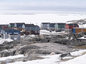 Homes face the Hudson Bay in Inukjuak, Que., on Thursday, May 12, 2022.