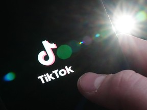 The TikTok startup page is displayed on an iPhone in Ottawa on Monday, Feb. 27, 2023.&ampnbsp;Quebec has banned the installation and use of the social media application TikTok on government cellphones. THE&ampnbsp;CANADIAN PRESS/Sean Kilpatrick