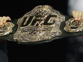 A UFC belt is held up during a news conference in Las Vegas, Thursday, Oct. 4, 2018. With only 14 Canadian-born fighters on a UFC active roster that numbers more than 600, an all-Canadian matchup is rare these days. But Canadian welterweights (Proper) Mike Malott and Yohan (White Lion) Lainesse will face off Saturday on the main card of a UFC Fight Night show in Las Vegas.