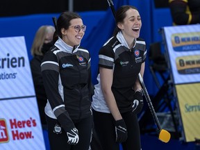Wild Card 1 skip Selena Njegovan, left, shares a laugh with her sister Robyn Njegovan at the Scotties Tournament of Hearts at Fort William Gardens in Thunder Bay, Ont., Sunday, Jan. 30, 2022. Selena Njegovan is planning to join her team at the upcoming Scotties Tournament of Hearts after being given clearance by Curling Canada to serve as a non-playing alternate.