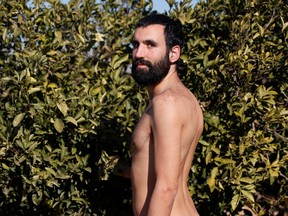 Alejandro Colomer poses naked in his vegetable garden, as Spanish court has ruled in favour of allowing him to continue walking around his village naked, as he has been doing since 2020.