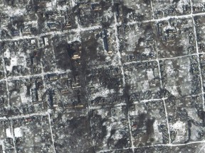 This satellite image provided by Maxar Technologies shows damaged areas in Petrivka of the Donetsk region, Ukraine, Friday, Feb. 10, 2023. (Maxar Technologies via AP)