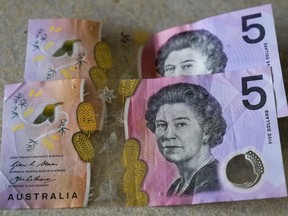Australian $5 notes are pictured in Sydney on Sept. 10, 2022.