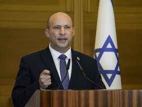 FILE - Israeli Prime Minister Naftali Bennett delivers a statement at the Knesset, Israel's parliament, in Jerusalem on June 29, 2022. Bennett, a former Israeli prime minister who served briefly as a mediator at the start of Russia's war with Ukraine, said during an interview posted online Saturday, Feb. 4, 2023, he drew a promise from the Russian president not to kill his Ukrainian counterpart.
