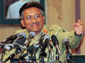 FILE - Then Pakistan Gen. Pervez Musharraf gestures at a news conference, Thursday March 23, 2000, in Islamabad. Gen. Musharraf, who seized power in a bloodless coup and later led a reluctant Pakistan into aiding the U.S. war in Afghanistan against the Taliban, has died, an official said Sunday, Feb. 5, 2023. He was 79.