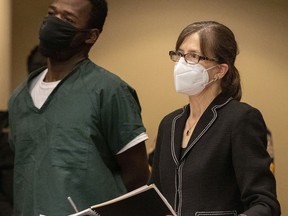Cleotha Henderson, 38, stands next to Jennifer "Jenny" Case, the supervisor for major cases in the Shelby County Public Defender's Office, during his court appearance Thursday, Sept. 15, 2022, in Memphis, for charges in connection to a 2021 rape and kidnapping.