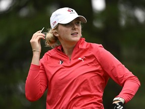 Canada's Katie Cranston tucks her tee back under her cap after teeing off at the 14th hole during the CP Women's Open in Ottawa, on Friday, Aug. 26, 2022. Cranston will make her NCAA tournament debut on Monday when she tees it up at the Nexus Collegiate event.