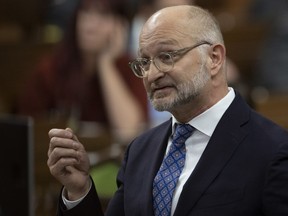 Canada's Justice Minister David Lametti is accusing Pierre Poilievre's Conservatives of using tragedies like the slaying of a young Ontario Provincial Police officer "to try to score political points." Lametti rises during Question Period, Tuesday, January 31, 2023 in Ottawa.