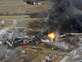 This photo taken with a drone shows portions of a Norfolk and Southern freight train that derailed Friday night in East Palestine, Ohio are still on fire at mid-day Saturday, Feb. 4, 2023.