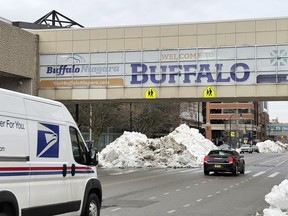 Cars drive past mounds of snow under a "Welcome to Buffalo" sign in Buffalo, N.Y., on Thursday, Dec. 29, 2022. A 4.2 magnitude earthquake was "lightly felt" in Ontario after it hit near Buffalo, N.Y., Earthquakes Canada said Monday – a light quake by international measures but the largest to hit the area in more than a half-century.
