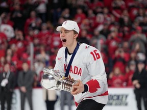 Canada's Connor Bedard carries the IIHF Championship Cup while celebrating winning over Czechia at the IIHF World Junior Hockey Championship gold medal game in Halifax on Thursday, January 5, 2023. Connor Bedard keeps packing arenas in Western Canada after his electrifying performance at the world junior men's hockey championship.